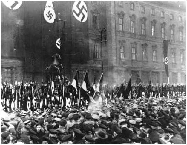 In Berlin, thousands of Party officials, Hitler Youth members, and Labor Service leaders take an oath of loyalty read by Rudolf Hess in Munich  1934